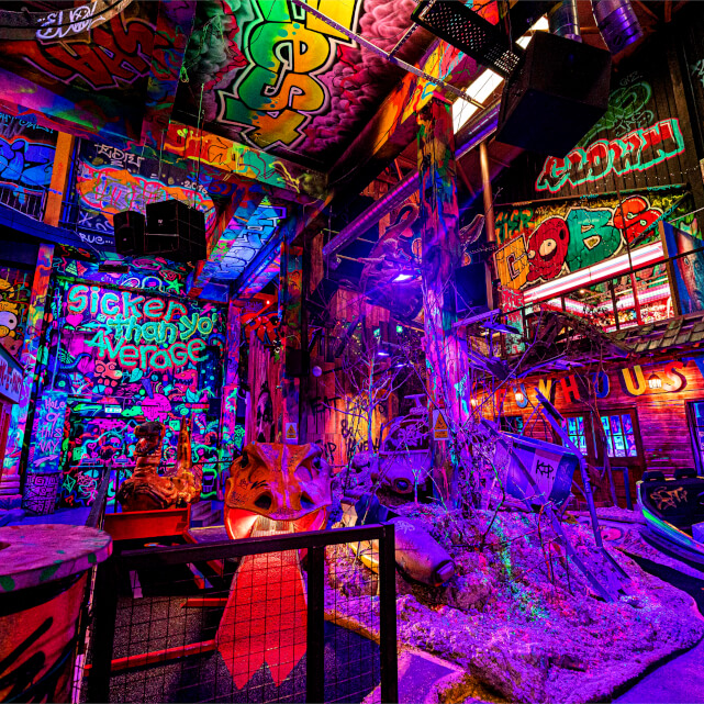 Colourful graffiti-themed indoor crazy golf course at Golf Fang Nottingham
