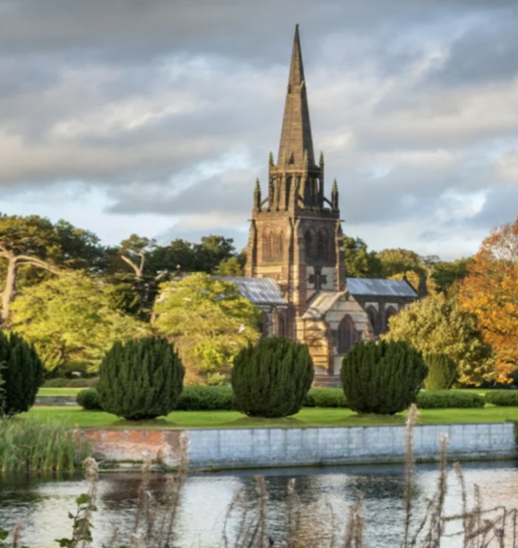 Expansive parkland and lake at Clumber Park with walking and cycling paths