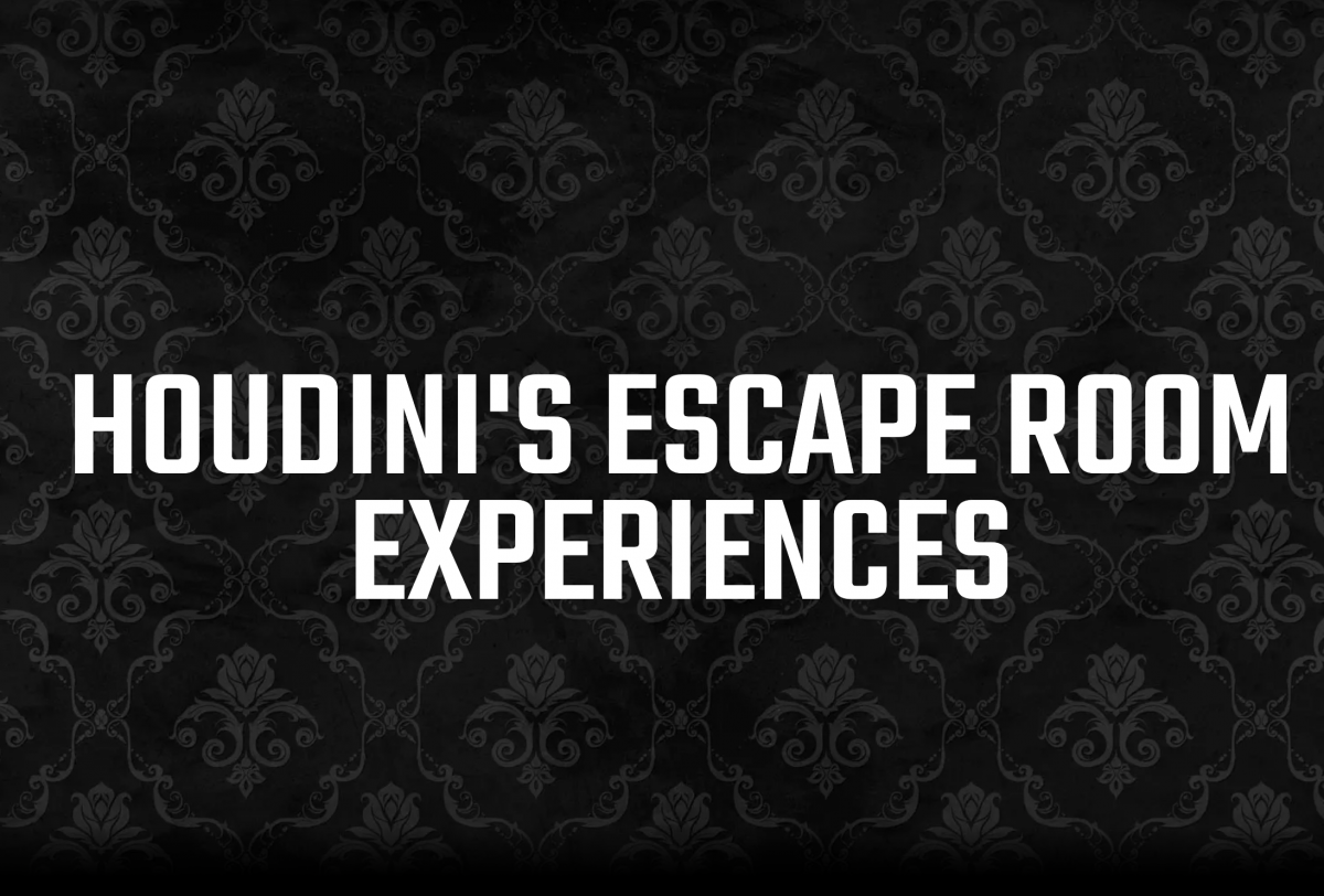 Escape room team solving puzzles in themed room
